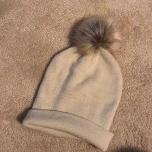 Lush cotton knit beanie with fur puff